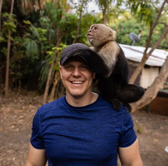 Meeting a white-faced capuchin monkey at the Monkey House, Costa Rica