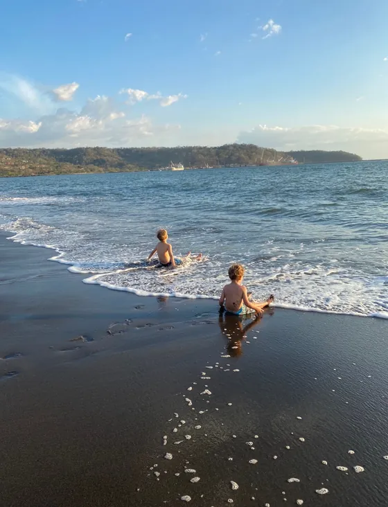Kids playing in the surf at Playa Caldera near Bella Vista, Costa Rica